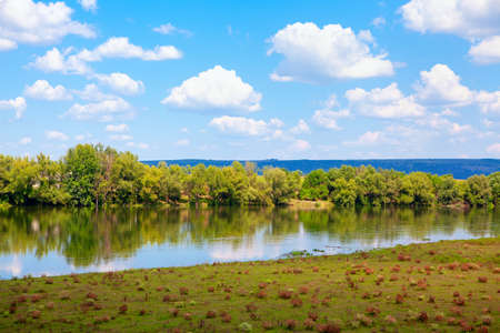 Beautiful riverside in the spring . Fresh springtime natureの写真素材