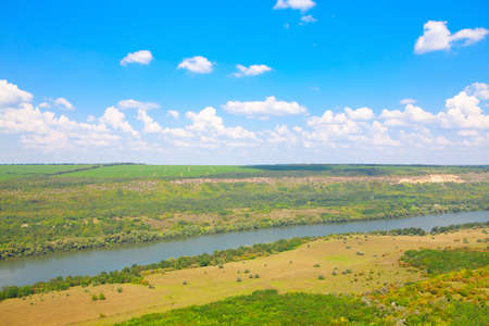 Untouched nature . Landscape with river and green hillsの写真素材