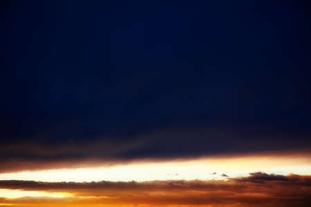 glowing horizon with dark clouds