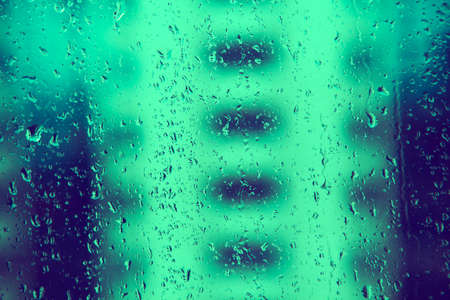 Drops an the windows in rainy cian nightの写真素材