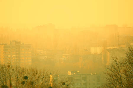 Yellow fog in the city . Morning cityscape in dense hazeの写真素材