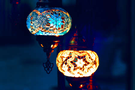 Turkish lamps at dark blue background . Mosaic Table Lamp in arabic styleの写真素材