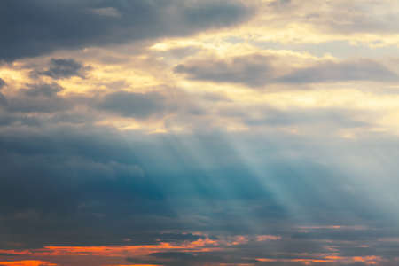 Diagonal sun rays in the dawn