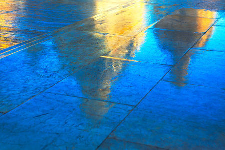 Golden Cathedral Cupola Reflection in Wet Pavement . Street after the rain