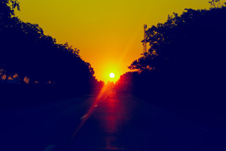 Driving at Sunrise . Sunlight over the highway in the morningの写真素材