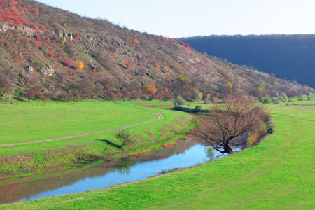 Landscape with hill river and green valley . Spring awesome nature