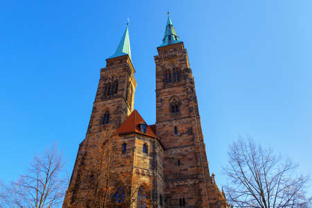 Lutheran church Saint Sebald in Nuremberg . Gothic Cathedral Towers . Sebalduskirche Nurnbergの写真素材