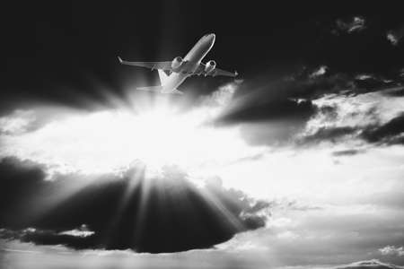 Plane flies through the dark clouds . Flight in the stormy weather