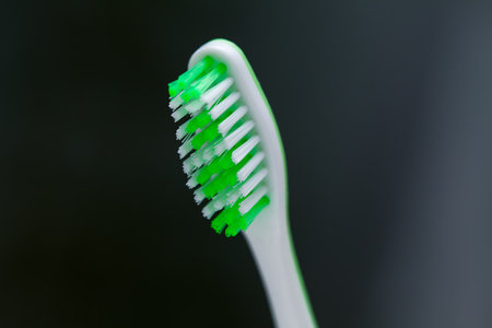 Toothbrush on a dark background . Soft toothbrush for gentle clean for sensitive teeth