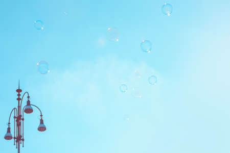 Soap bubbles on the background of the blue skyの写真素材