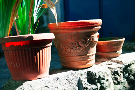 Flower pots in the sunlight . Pots for flowers made by clayの写真素材