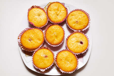 Cupcakes on the plate . Homemade Vanilla cakes
