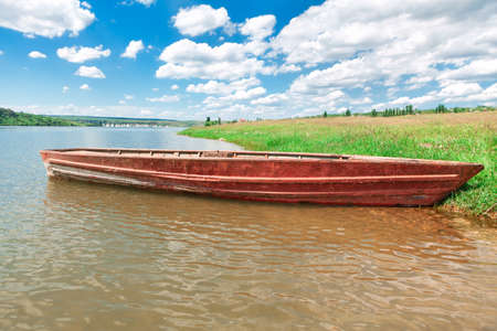 River nature with wooden boat . Rustic riverside , fishing villageの写真素材