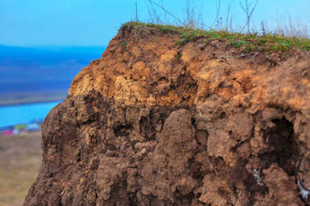 Natural clay cliff . Geological reserve background