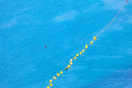 Swimming marker in the sea . Beach buoys in blue waterの写真素材