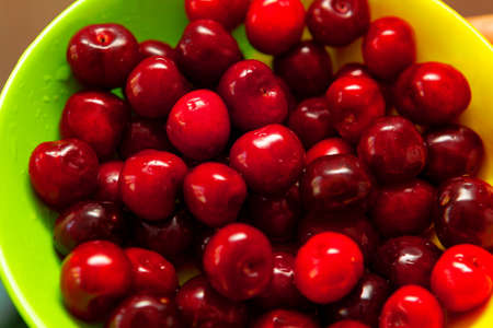 Fresh tasty cherries in the plate , ready to eatの写真素材