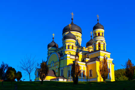 Orthodox church painted in yellow . Monastery Hincu , famous place of worship in Moldova