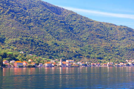View of Perast town from the Kotor Bay in Montenegro . View of coastal town and mountain