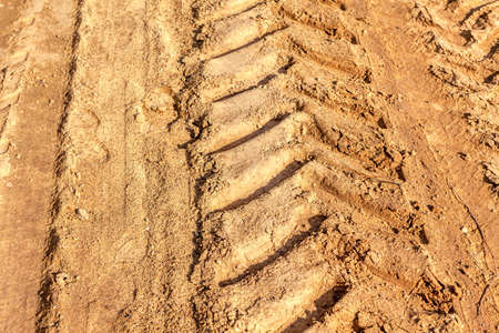 Tractor trail on the clay . Trail tracks on the mudの写真素材