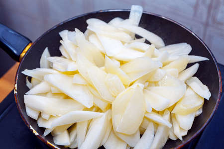 Frying potato in the pan . Fried potatoes, traditional rustic eatingの写真素材