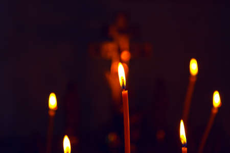 Candles in the dark . Candles Burning On The Black Backgroundの写真素材