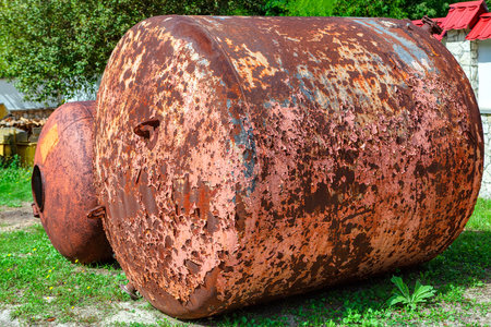 Large Rusty water barrel . Old Water tower , peeled paintの写真素材