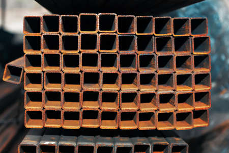 Steel profile on a warehouse rack . Pile of metallurgical productionの写真素材