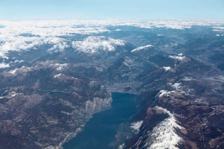 Lake Garda and Alps view from above . Aerial view of snowy mountain an lake . largest lake in Italy...