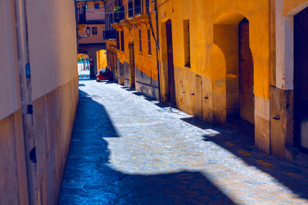 Narrow street with cobblestone . Old town street in Palma de Mallorca Spain . Residential district