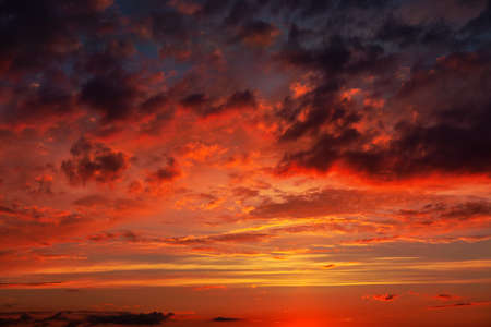 Red atmosphere with clouds . Spectacular evening sky