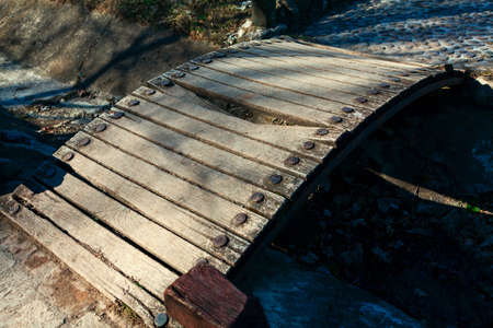 Walkway old bridge . Wooden footbridge with broken plankの写真素材
