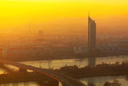 Vienna panorama in the evening . Aerial view of Danube river and bridge in Vienna