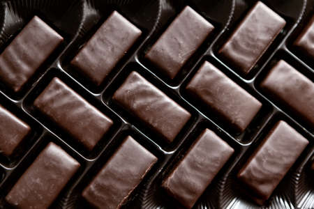 Chocolate candies in a row . Box with sweetsの写真素材