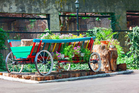 Decorative horse drawn wagon with flowers . Design in rustic styleの写真素材