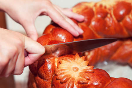 Slicing bread . Cutting with Knife A Loaf Of Bread