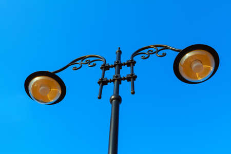 Street light against sky . City lamps at blue backgroundの写真素材