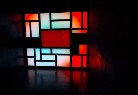 Window with colorful glass in dark room . Gradient light and dim lightの写真素材