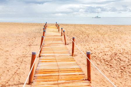 Pathway at the beach . Sandy coast with walking pathの写真素材