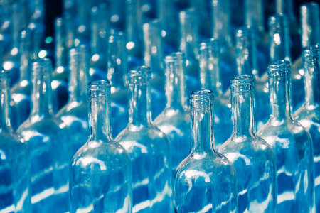 Empty bottles in a row . Glass bottles backgroundの写真素材