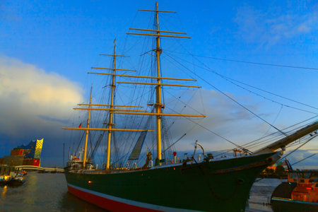 Nautical vessel with masts in Hamburg Germany . Moored yacht in the evening