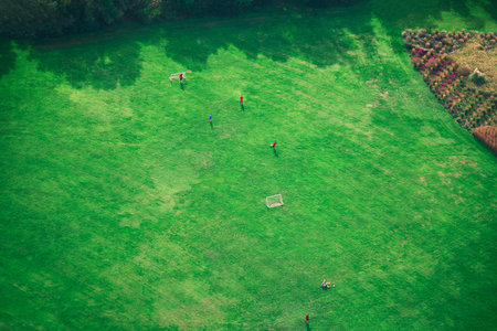 Soccer field in the park aerial view . Children playing football in parkの写真素材