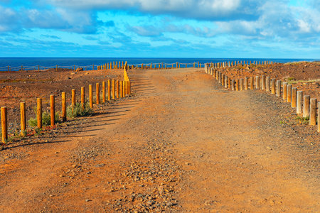 Logs fenced walk path . Walking at ocean coast
