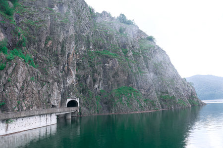 Vidraru Dam Lake in Romania . Foggy scenery with mountains and lake . Vidra Lake  Valcea County Romania.の写真素材