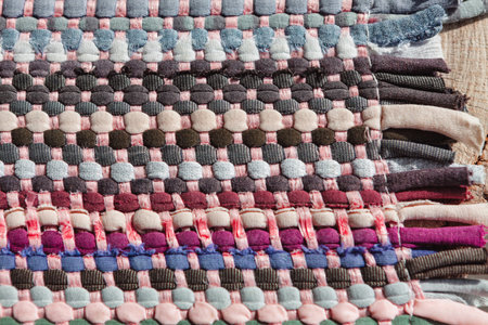 Braided colorful fabrics texture . Handwork the rug . Multicolor fabrics backgroundの写真素材