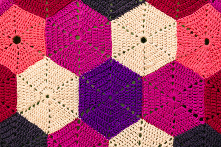 Handmade crocheted background. Close-up of knitted pattern.