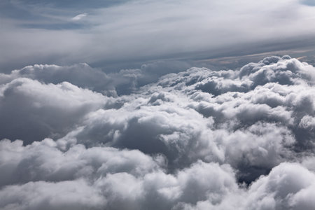 Cloudscape, view from the window of an airplane flying above the clouds