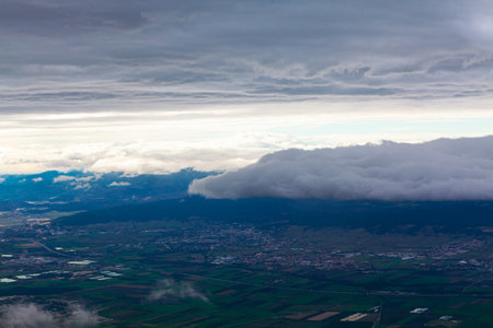 Clouds and sky as seen through window of an aircraft,