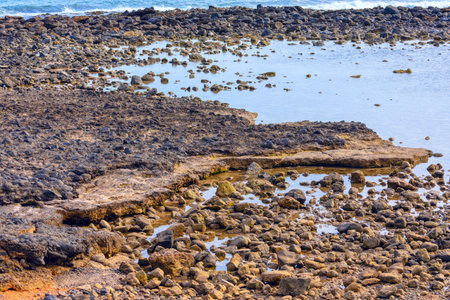 Tranquil coast among the rocks and stones that line the shore of the ocean