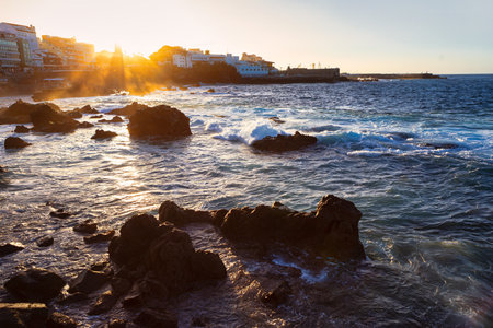Sunset over the ocean in Puerto de la Cruz from Tenerife from Tenerife, Canary Islands. Rocks...