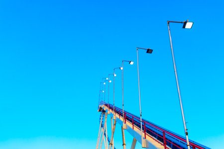 Series of lights are lined up on roller coaster. Illumination lamps at carouselの写真素材